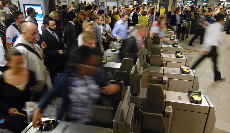 London commuters paying for the Tube at rush hour